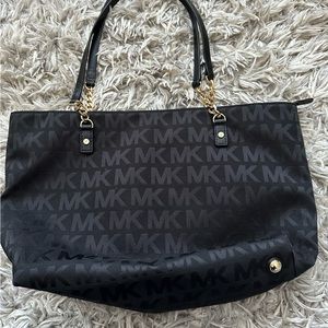 Michael Kors purse, black with gold chain accent handle.